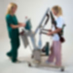 Woman ambulating using a sit-to-stand.